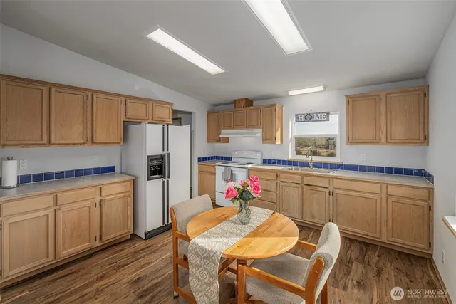 a kitchen with a sink cabinets and appliances