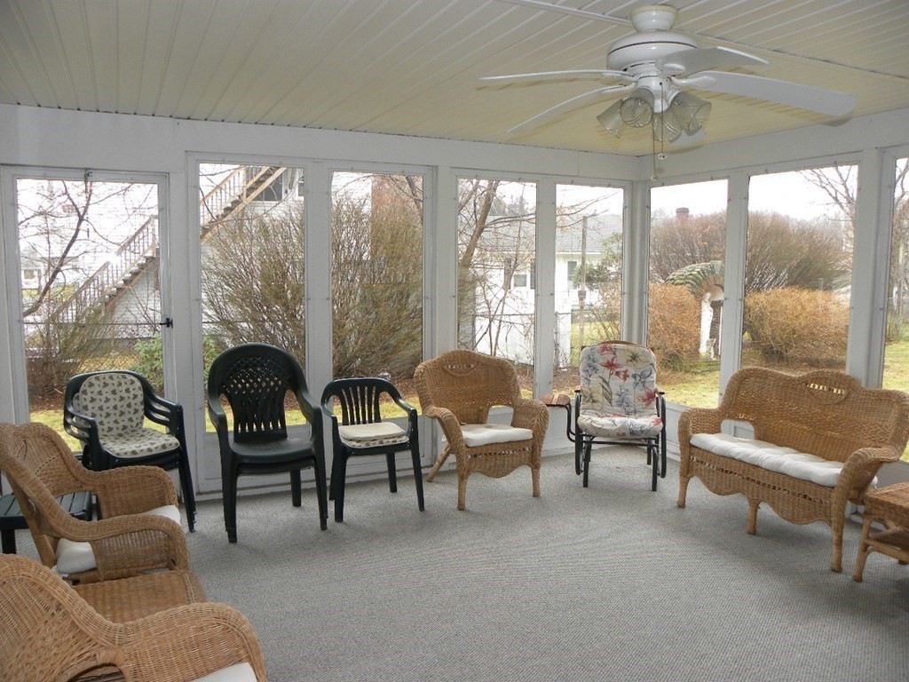 8 Everett Avenue Webster, MA 01570 - Photo 11 of 29 a living room with furniture and a floor to ceiling window