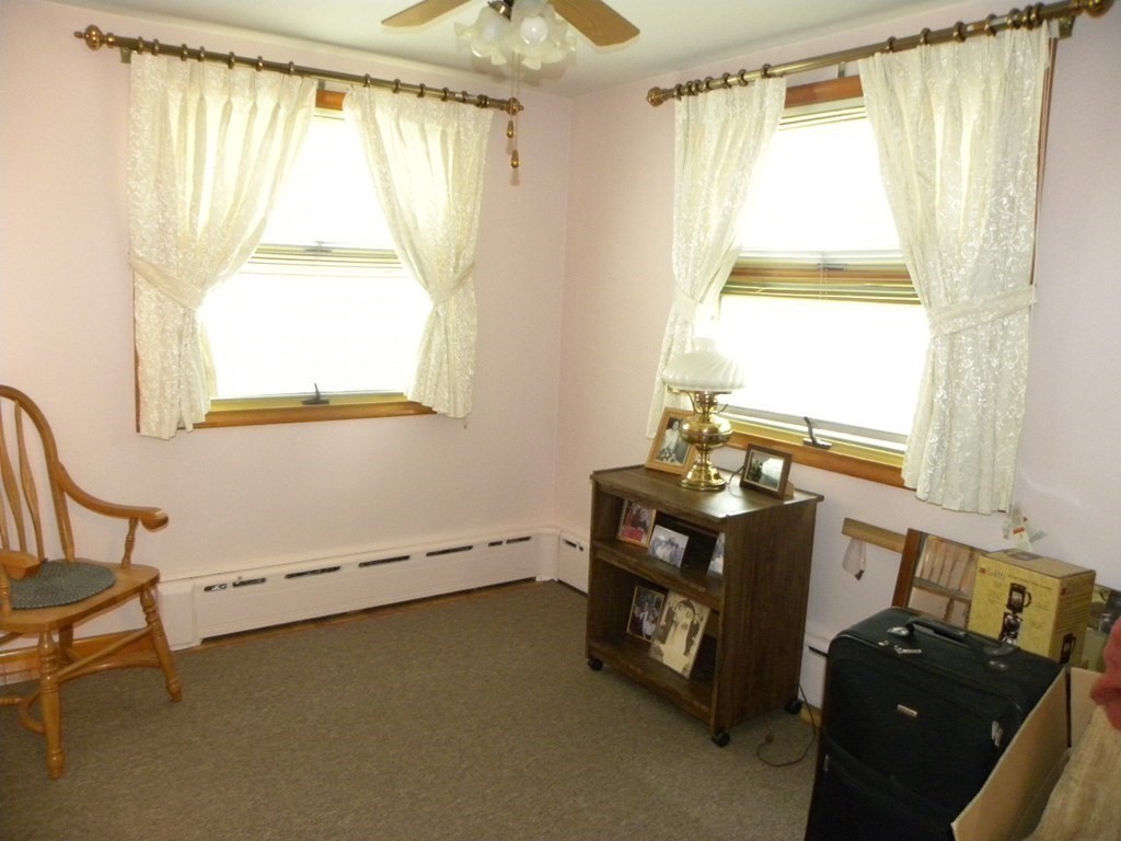 8 Everett Avenue Webster, MA 01570 - Photo 14 of 29 a bedroom with a bed and a window