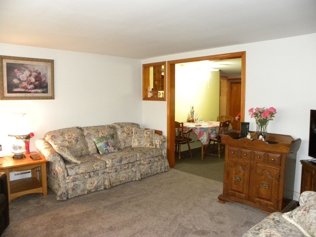 8 Everett Avenue Webster, MA 01570 - Photo 15 of 29 a living room with furniture and a large window