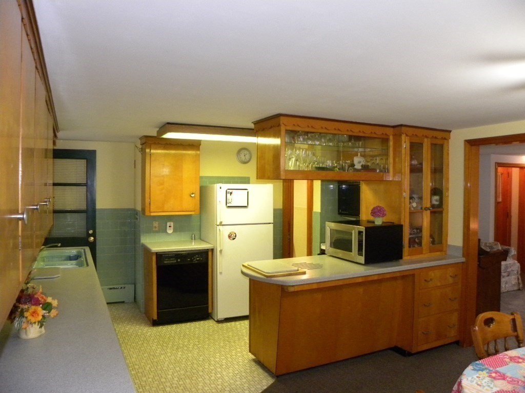 8 Everett Avenue Webster, MA 01570 - Photo 20 of 29 a room with furniture and flat screen tv