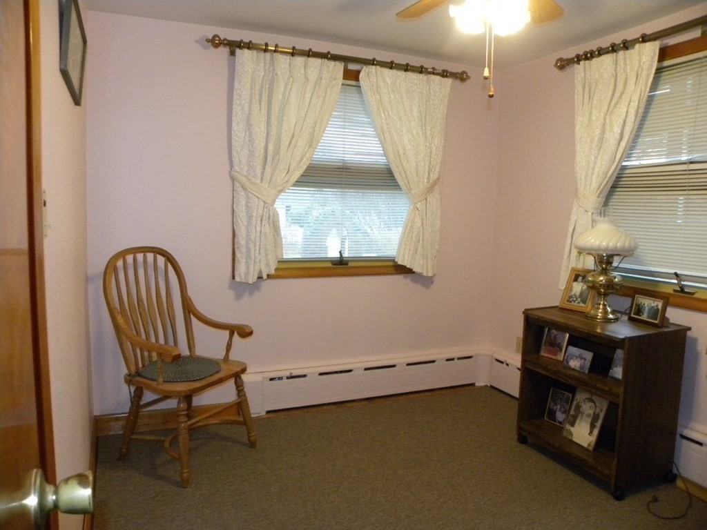 8 Everett Avenue Webster, MA 01570 - Photo 27 of 29 a room that has a bed and a chair in it