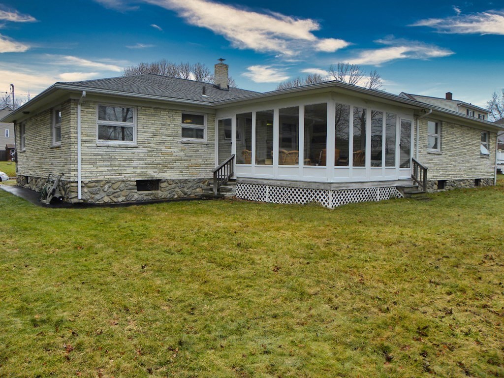 8 Everett Avenue Webster, MA 01570 - Photo 4 of 29 a view of a house with a yard