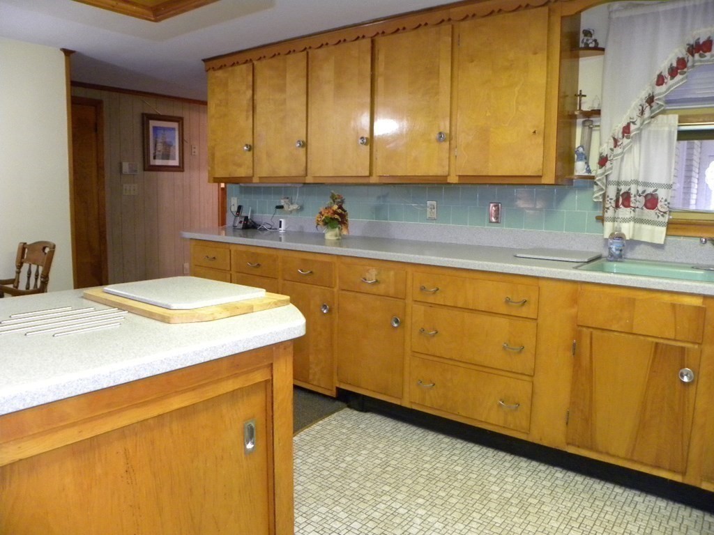 8 Everett Avenue Webster, MA 01570 - Photo 6 of 29 a kitchen with sink and cabinets