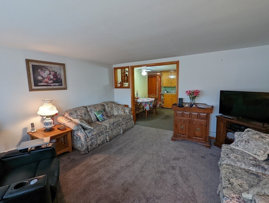 8 Everett Avenue Webster, MA 01570 - Photo 8 of 29 a living room with furniture and a flat screen tv