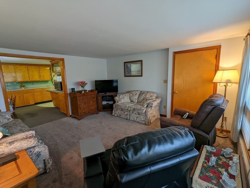 8 Everett Avenue Webster, MA 01570 - Photo 9 of 29 a living room with furniture and a window