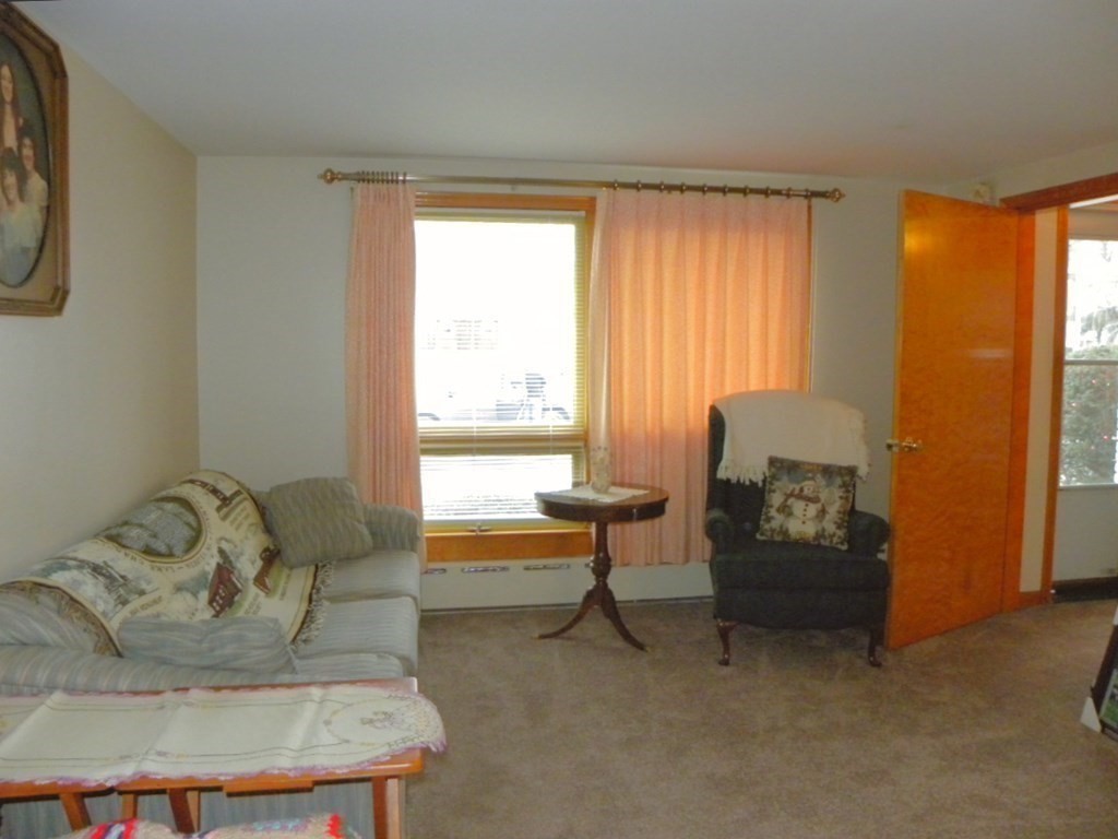 8 Everett Avenue Webster, MA 01570 - Photo 10 of 29 a living room with furniture and a window