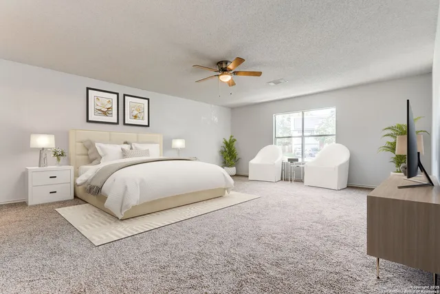 a bedroom with bed and white walls