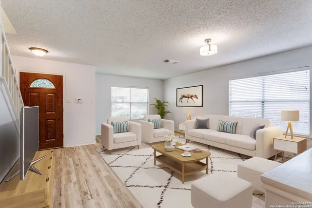 a living room with furniture and a window