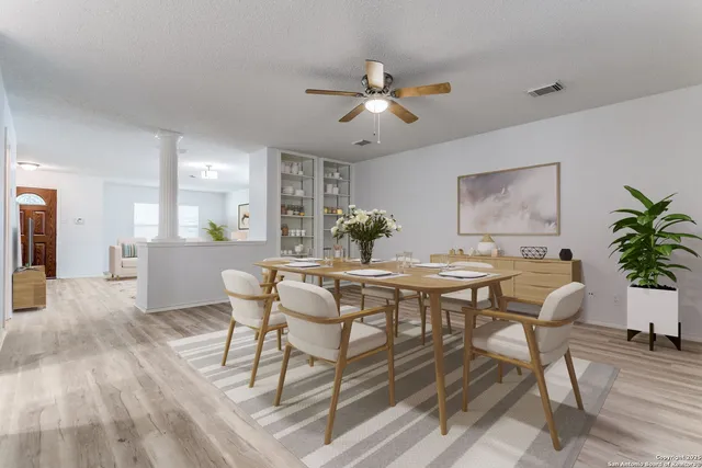 a view of a dining room with furniture and window