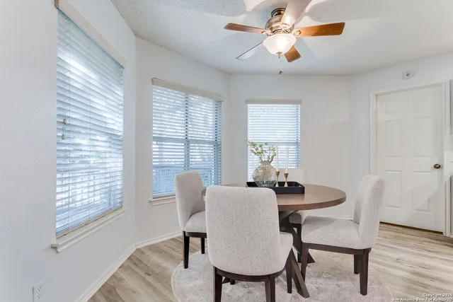a dining room with furniture and window