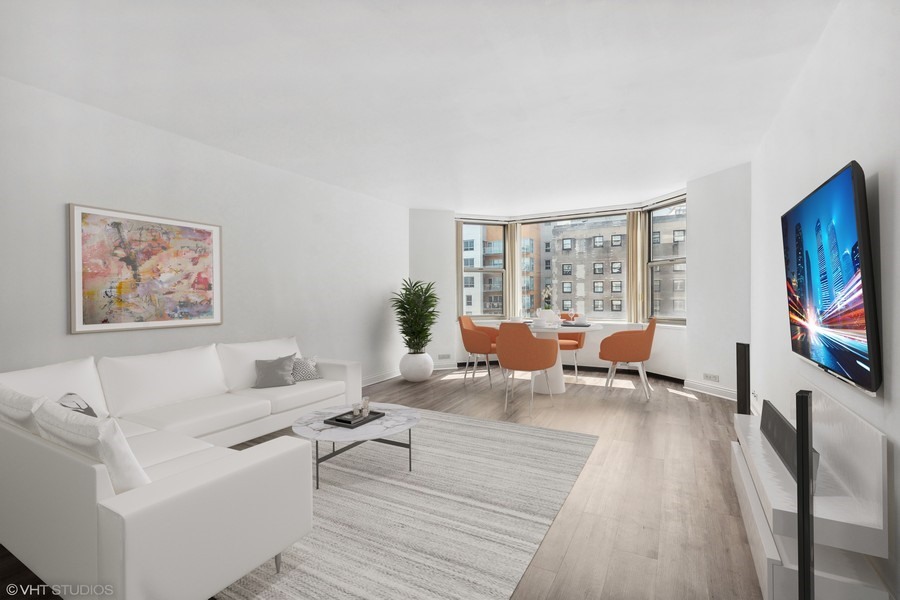 535 North Michigan Avenue, Unit 2505 Chicago, IL 60611 - Photo 3 of 14 a living room with furniture and a flat screen tv