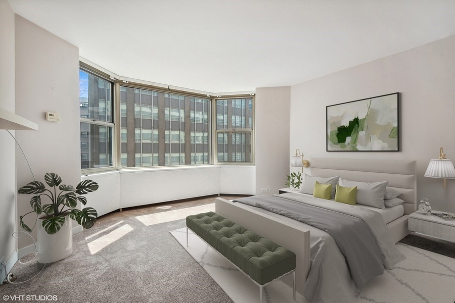 535 North Michigan Avenue, Unit 2505 Chicago, IL 60611 - Photo 6 of 14 a bedroom with a bed and wooden floor