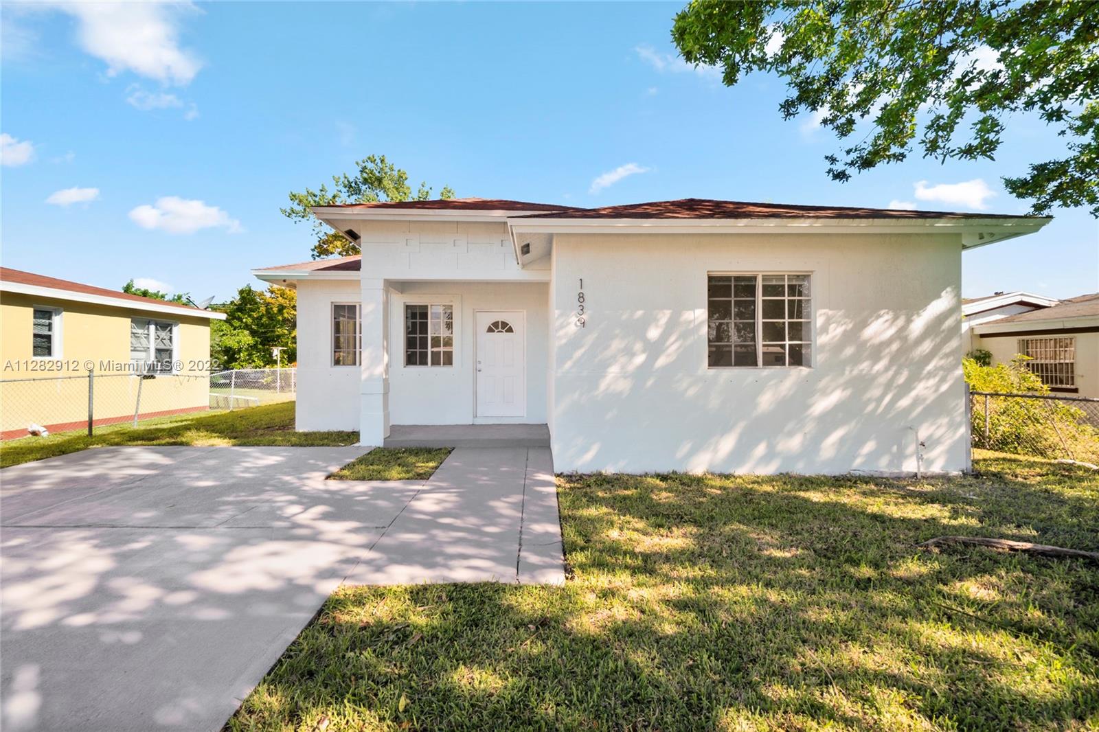 a view of a house with a yard