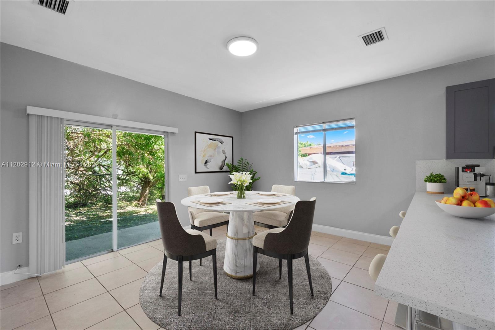 Gladeview Miami, FL 33147 - Photo 12 of 31 a view of a dining room with furniture window and outside view