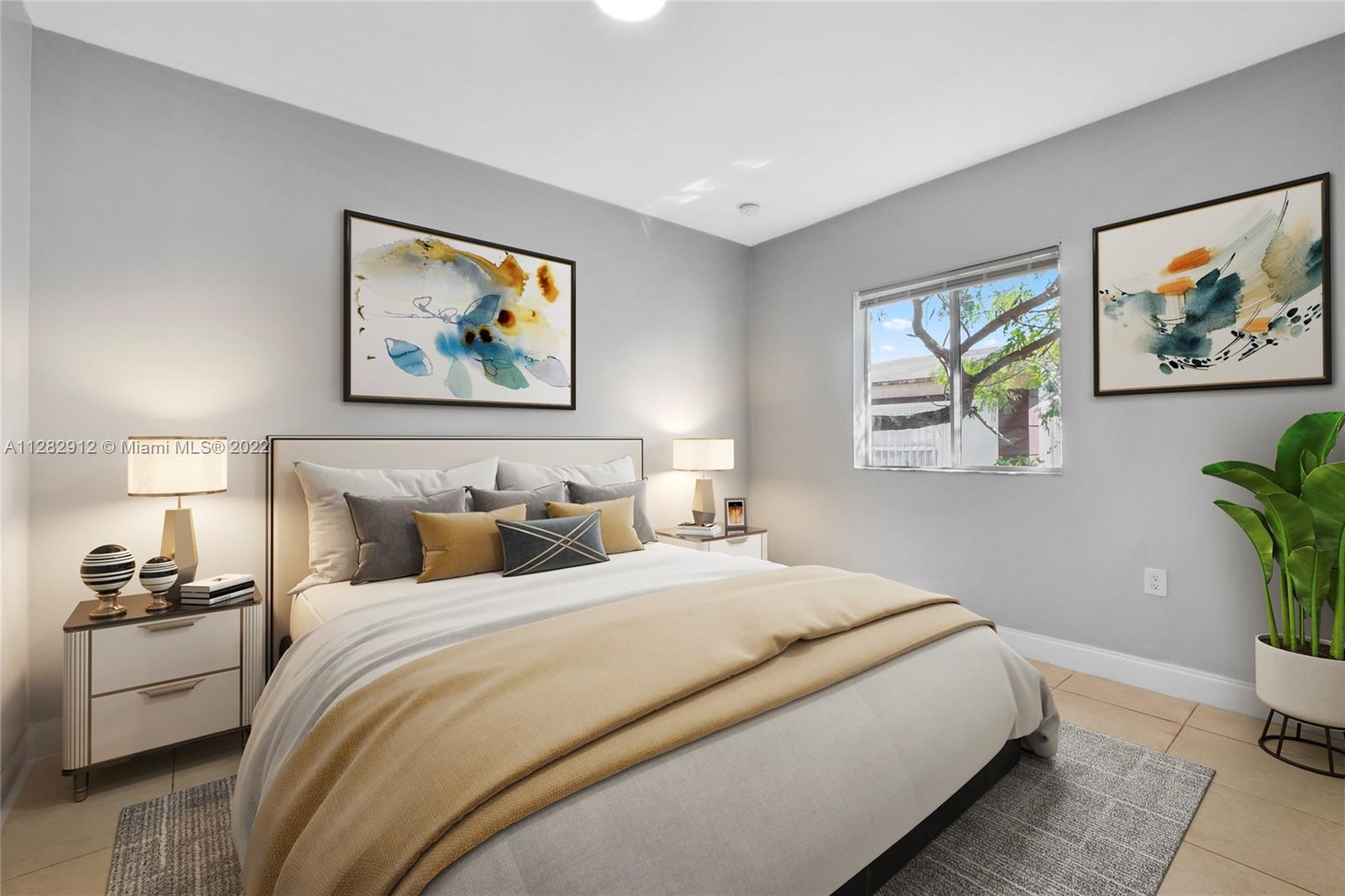 Gladeview Miami, FL 33147 - Photo 22 of 31 a bedroom with bed and wall painting with wooden floor