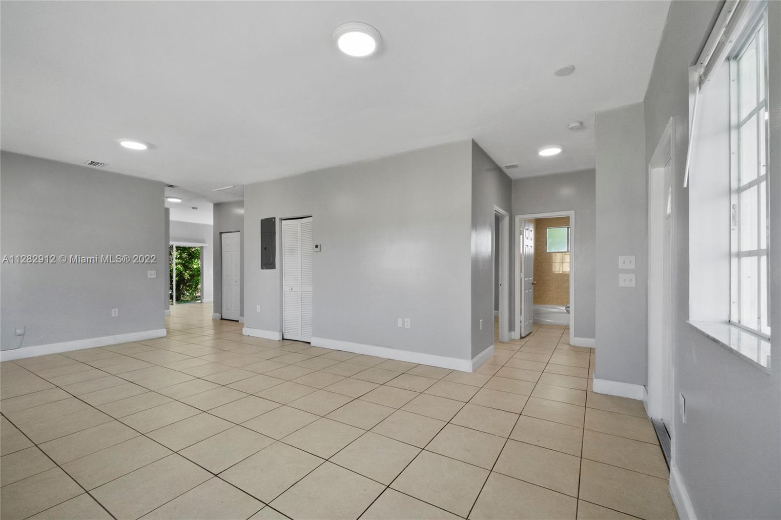 Gladeview Miami, FL 33147 - Photo 26 of 31 an empty room with entrance and windows