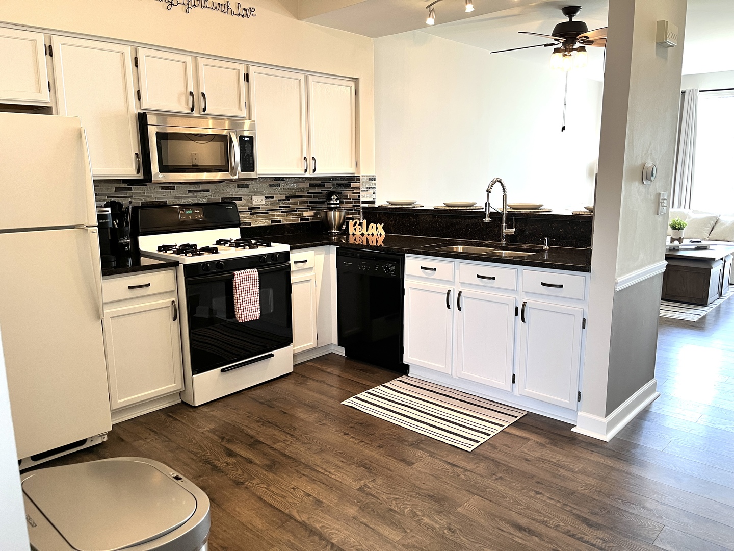 17807 Braewick Road Gurnee, IL 60031 - Photo 7 of 24 a kitchen with a sink stove and microwave