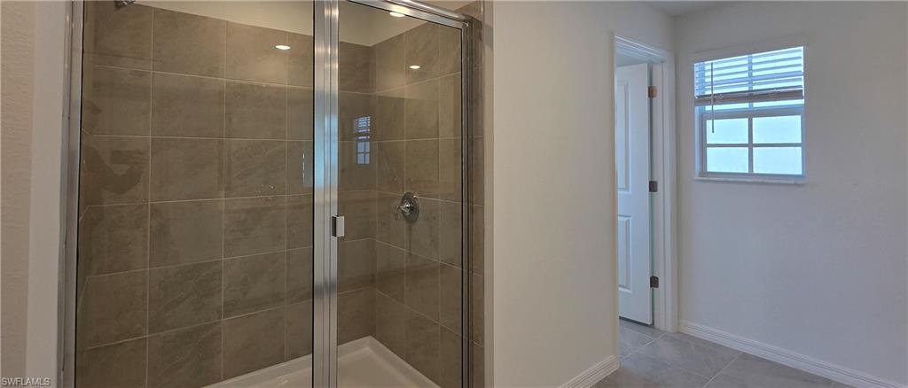 13329 Turnleaf Boulevard Punta Gorda, FL 33955 - Photo 14 of 23 Full bath featuring a shower stall and light tile patterned floors