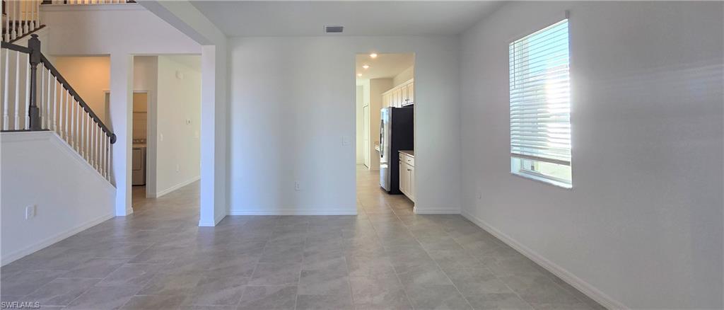 13329 Turnleaf Boulevard Punta Gorda, FL 33955 - Photo 5 of 23 Unfurnished room featuring stairs and washer / dryer
