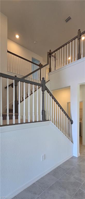 13329 Turnleaf Boulevard Punta Gorda, FL 33955 - Photo 6 of 23 Staircase featuring baseboards