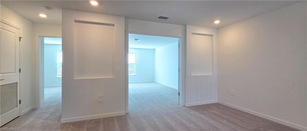 13329 Turnleaf Boulevard Punta Gorda, FL 33955 - Photo 10 of 23 Hall featuring carpet floors and recessed lighting