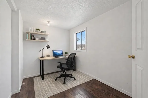 a bed room with a bed and a chair