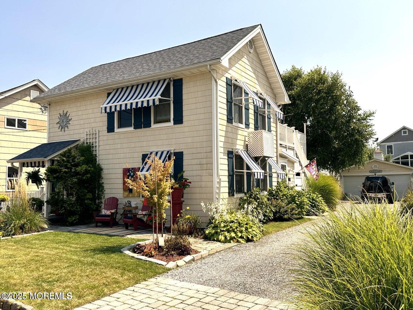 14 Cook Street, Unit DOWNSTAIRS Monmouth Beach, NJ 07750 - Photo 1 of 33 a front view of a house with garden