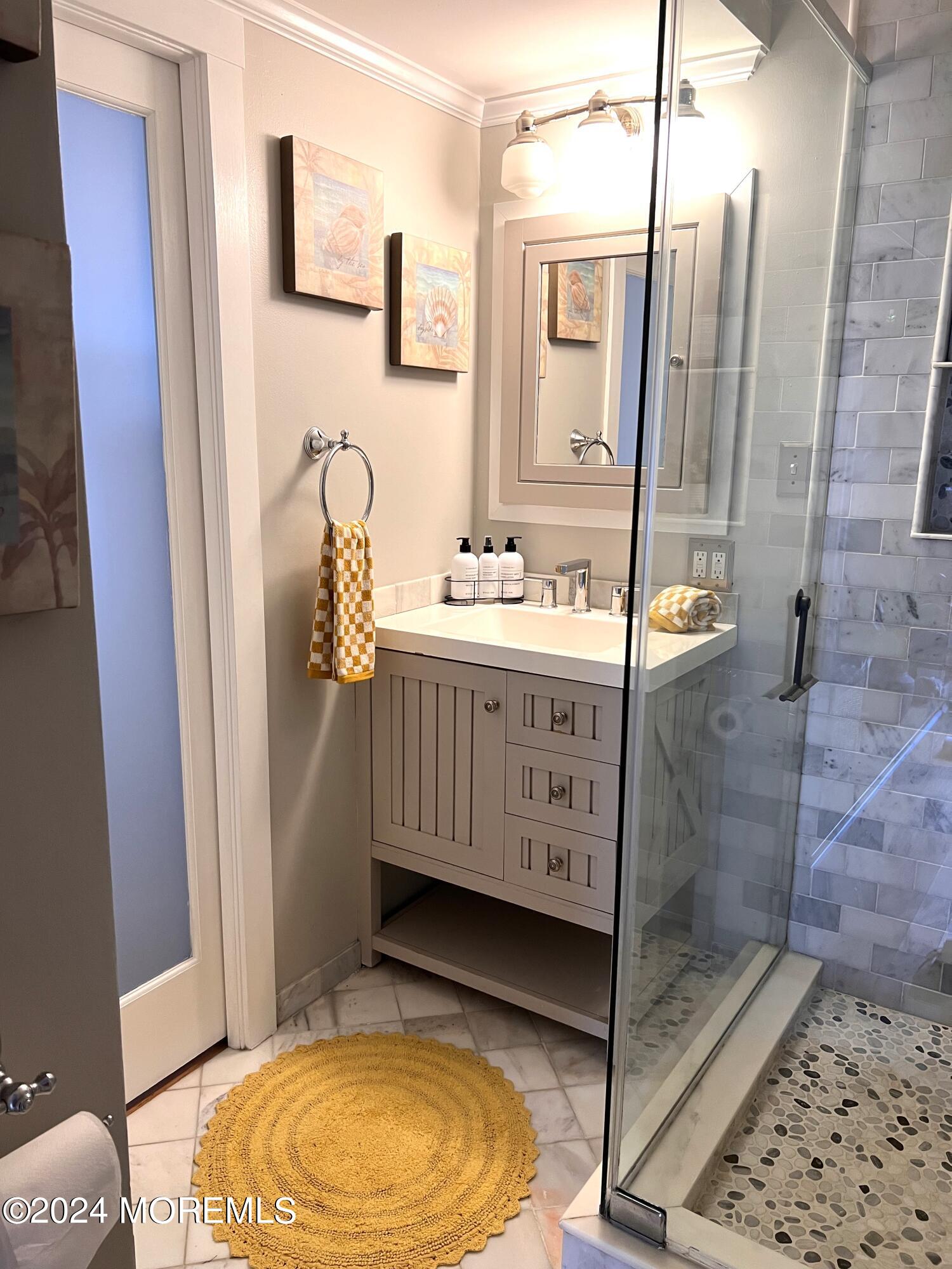 14 Cook Street, Unit DOWNSTAIRS Monmouth Beach, NJ 07750 - Photo 13 of 33 a bathroom with a granite countertop sink and a mirror