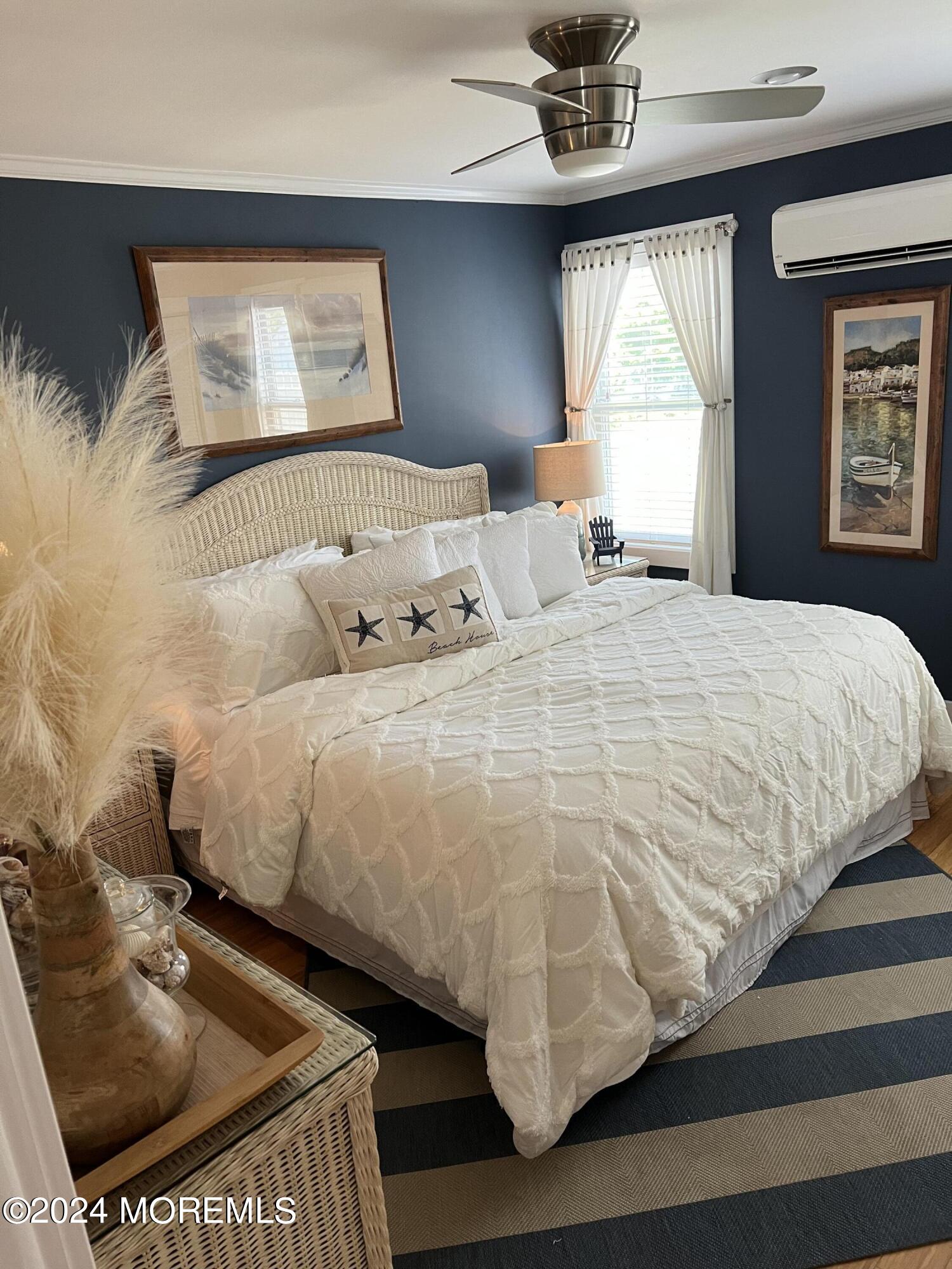 14 Cook Street, Unit DOWNSTAIRS Monmouth Beach, NJ 07750 - Photo 16 of 33 a bedroom with a bed and a window