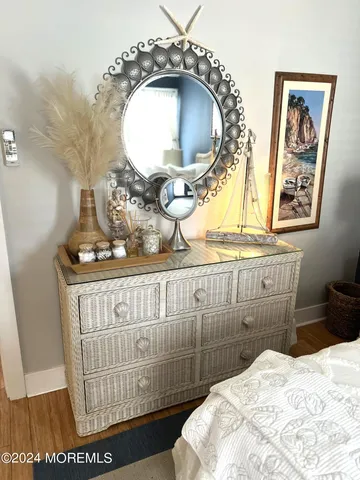 a bathroom with a sink mirror vanity and toilet
