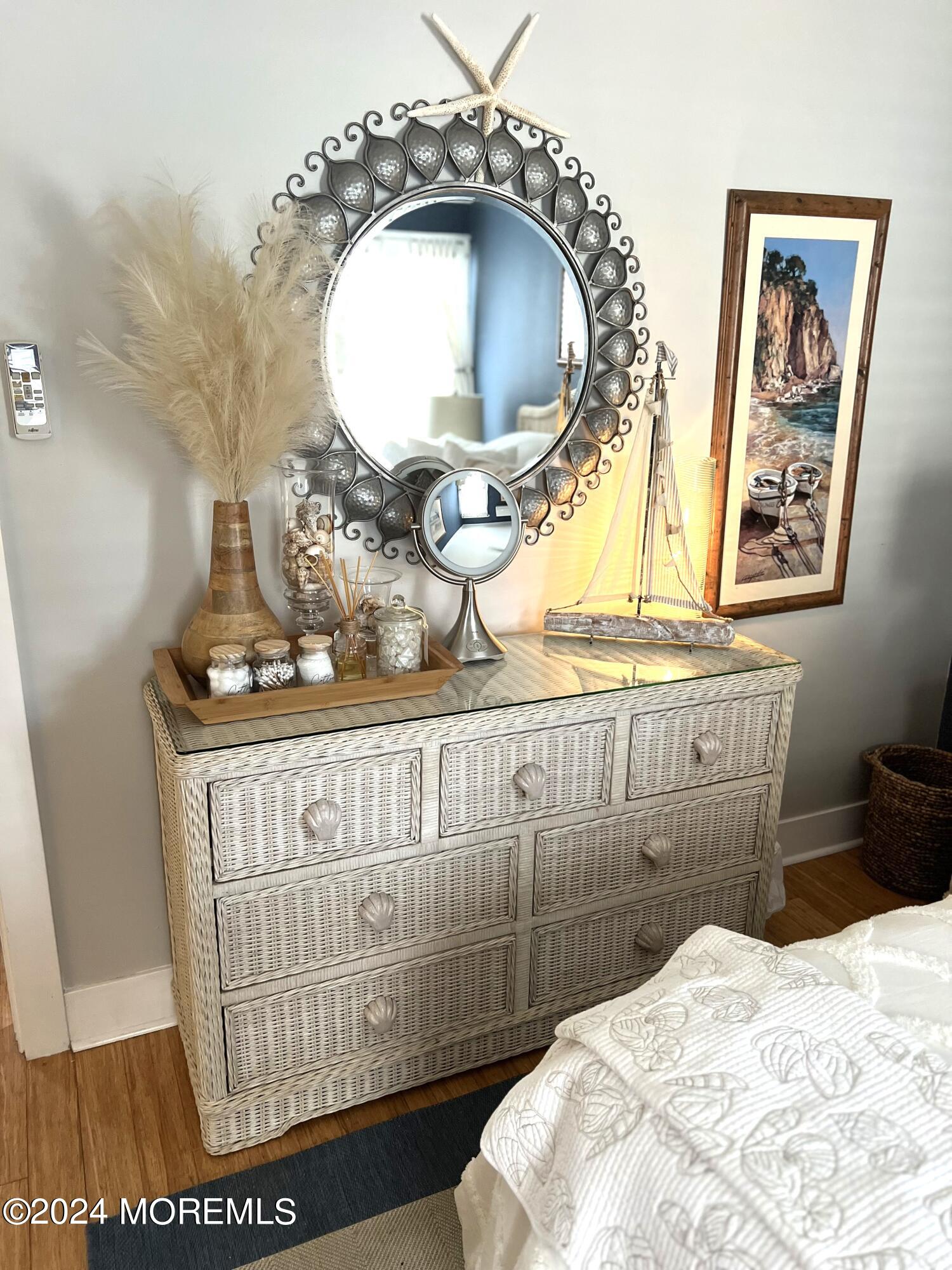 14 Cook Street, Unit DOWNSTAIRS Monmouth Beach, NJ 07750 - Photo 17 of 33 a bathroom with a sink mirror vanity and toilet