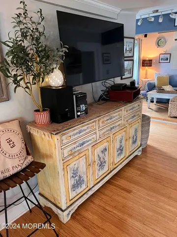 a kitchen with stainless steel appliances granite countertop a stove and a wooden floors