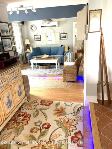 a living room with furniture and a rug