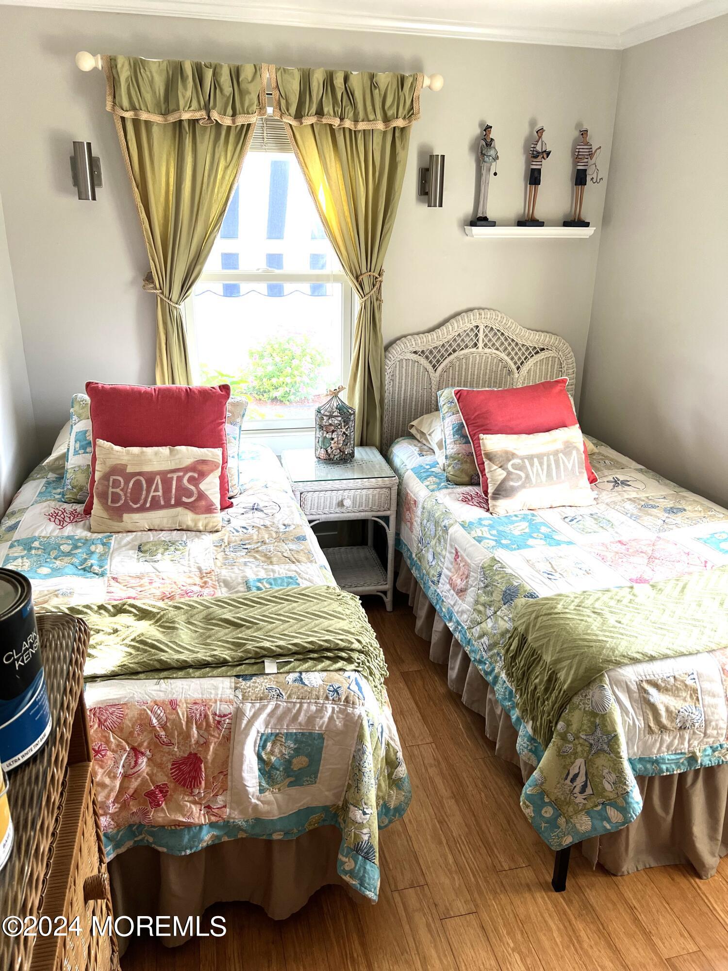 14 Cook Street, Unit DOWNSTAIRS Monmouth Beach, NJ 07750 - Photo 24 of 33 a bedroom with bed and window