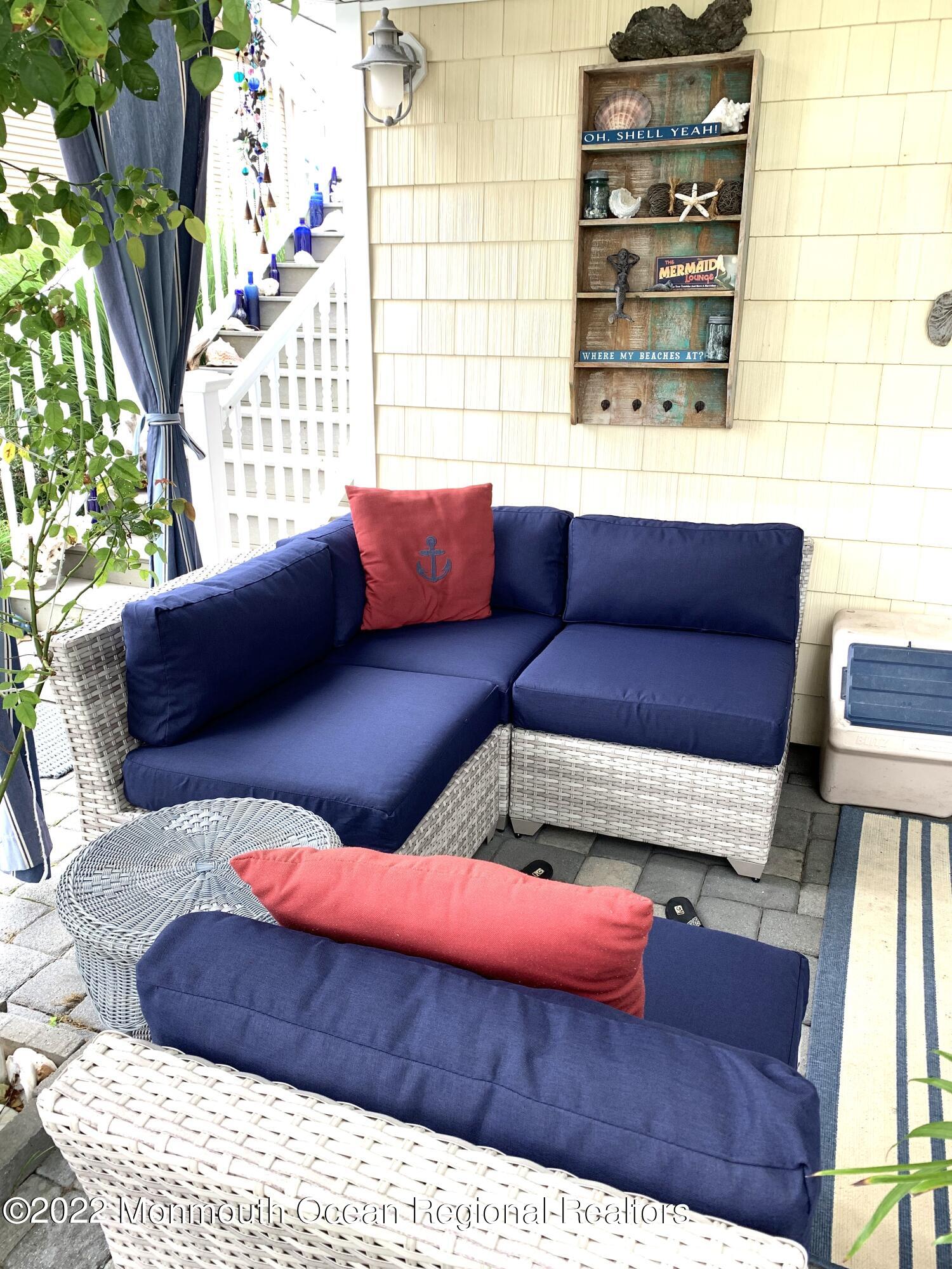 14 Cook Street, Unit DOWNSTAIRS Monmouth Beach, NJ 07750 - Photo 26 of 33 a living room with a couch and a potted plant
