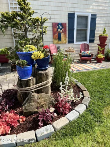 a building outdoor space with lots of different kinds of flowers