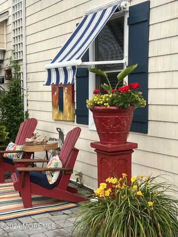 a view of outdoor sitting area with furniture