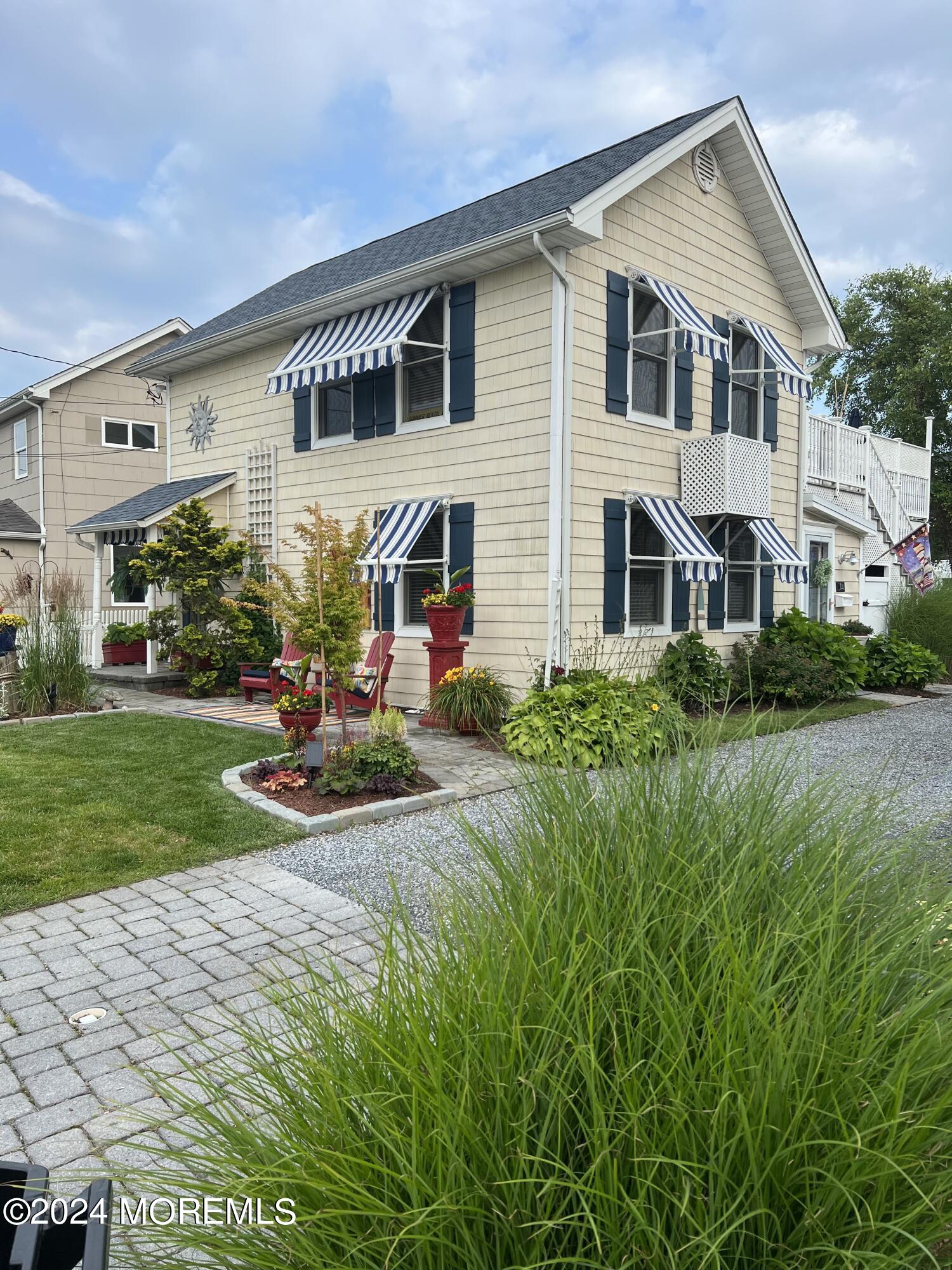 14 Cook Street, Unit DOWNSTAIRS Monmouth Beach, NJ 07750 - Photo 32 of 33 a front view of a house with garden and plants