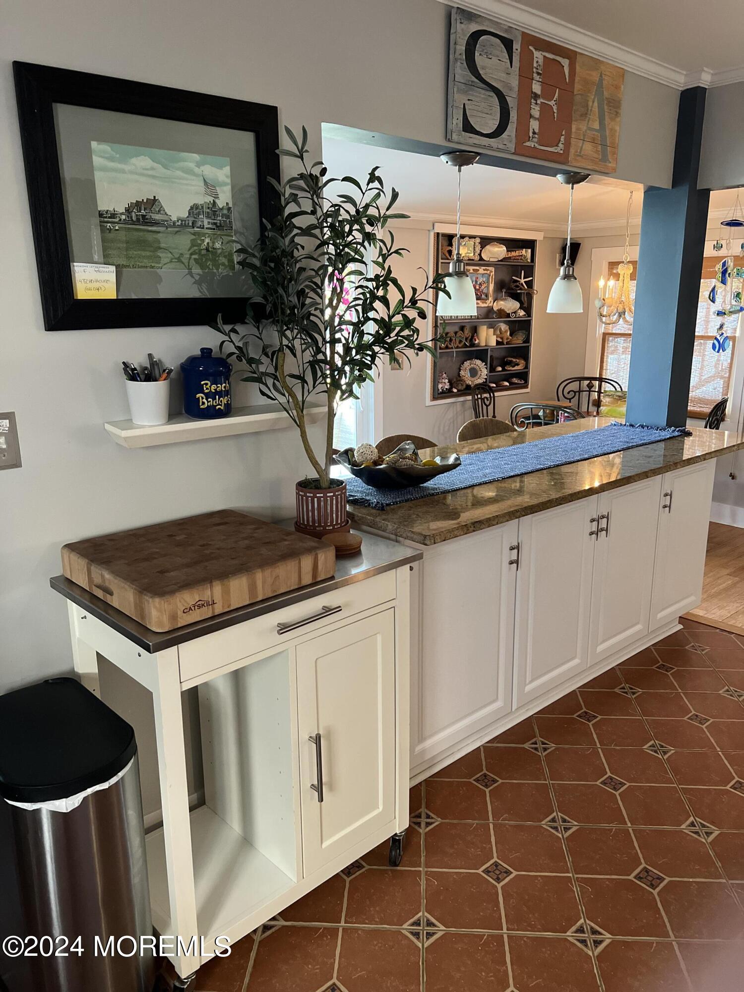14 Cook Street, Unit DOWNSTAIRS Monmouth Beach, NJ 07750 - Photo 5 of 33 a kitchen with stainless steel appliances granite countertop a stove a sink and a microwave