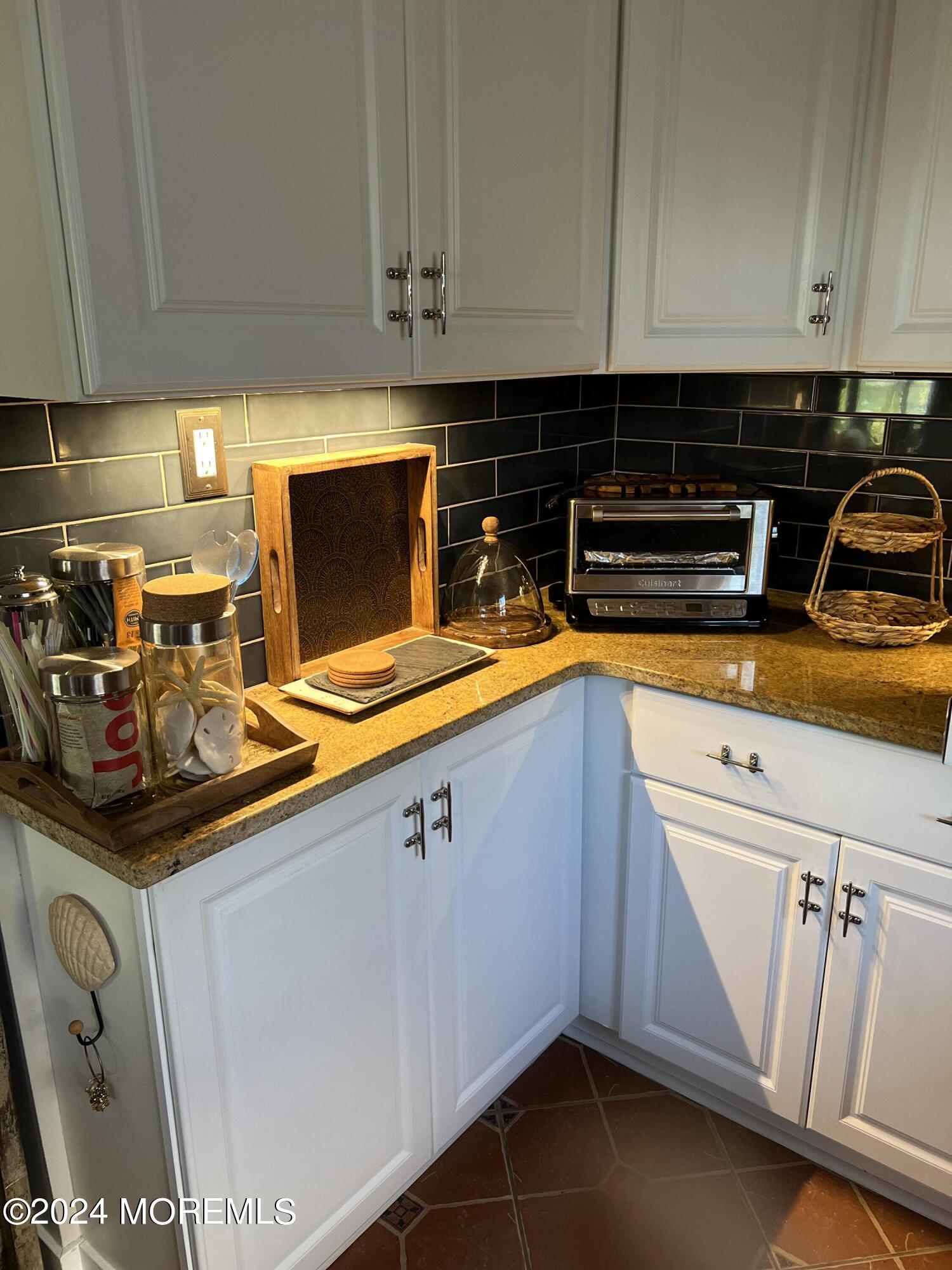 14 Cook Street, Unit DOWNSTAIRS Monmouth Beach, NJ 07750 - Photo 8 of 33 a kitchen with a sink and cabinets
