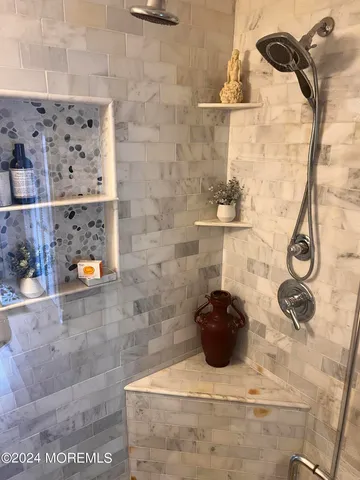 a bathroom with a sink and mirror