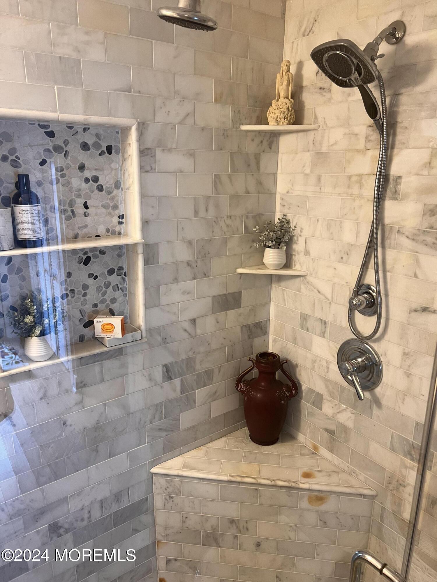 14 Cook Street, Unit DOWNSTAIRS Monmouth Beach, NJ 07750 - Photo 10 of 33 a bathroom with a sink and mirror