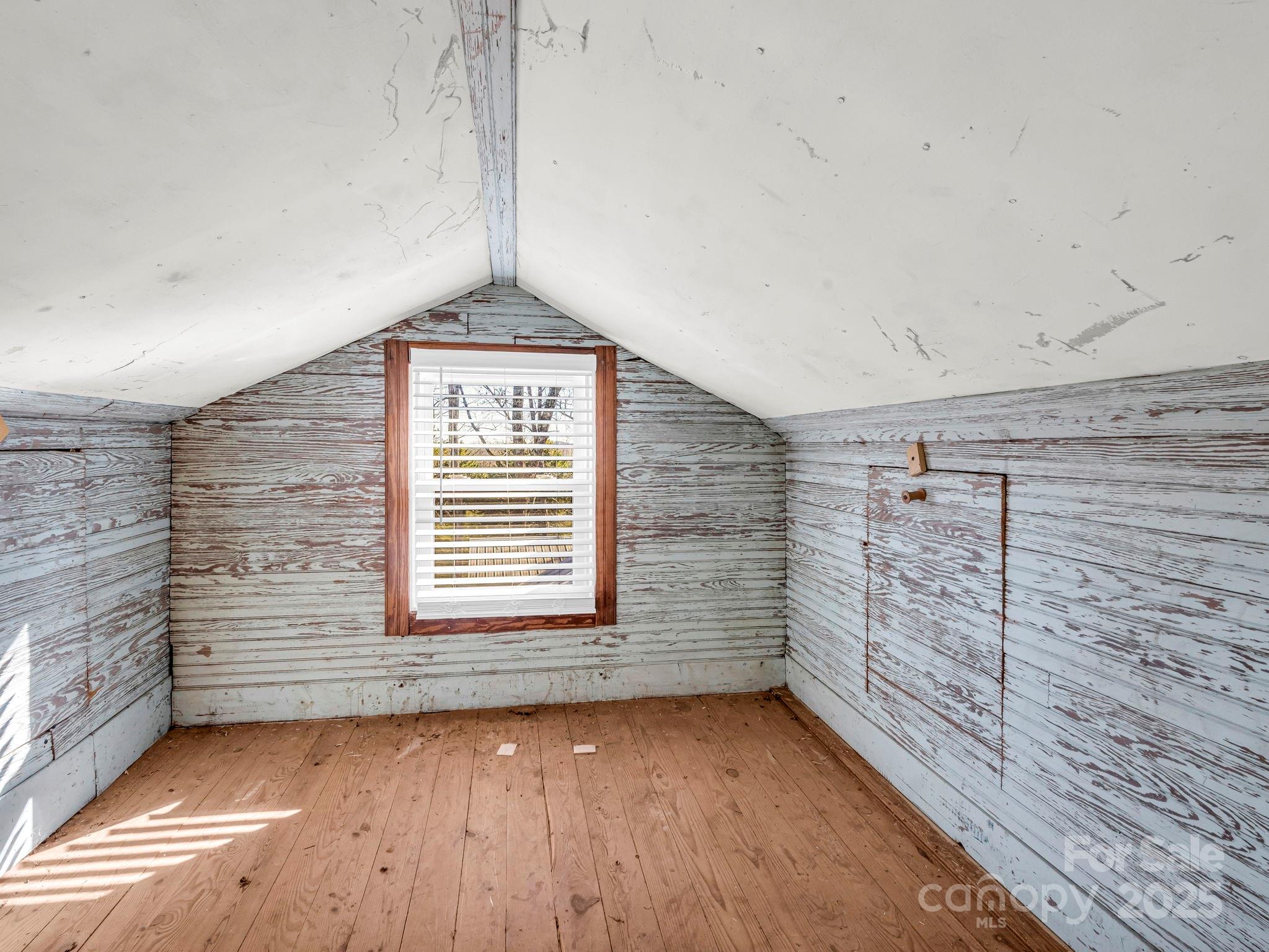 620 Smith Waldrop Road Columbus, NC 28722 - Photo 11 of 42 a view of a hallway with wooden floor and a window