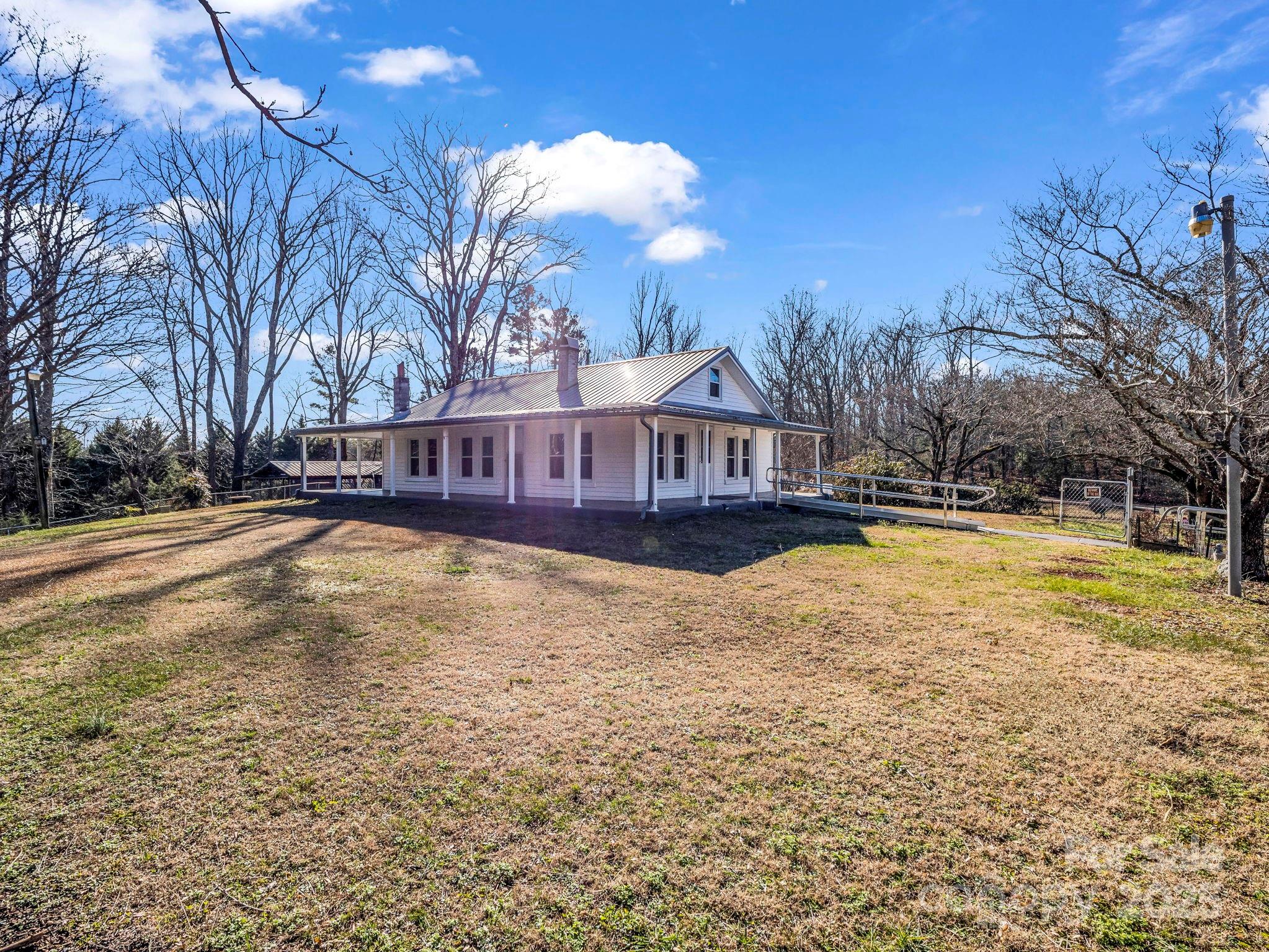 620 Smith Waldrop Road Columbus, NC 28722 - Photo 2 of 42 a view of house with outdoor space and swimming pool