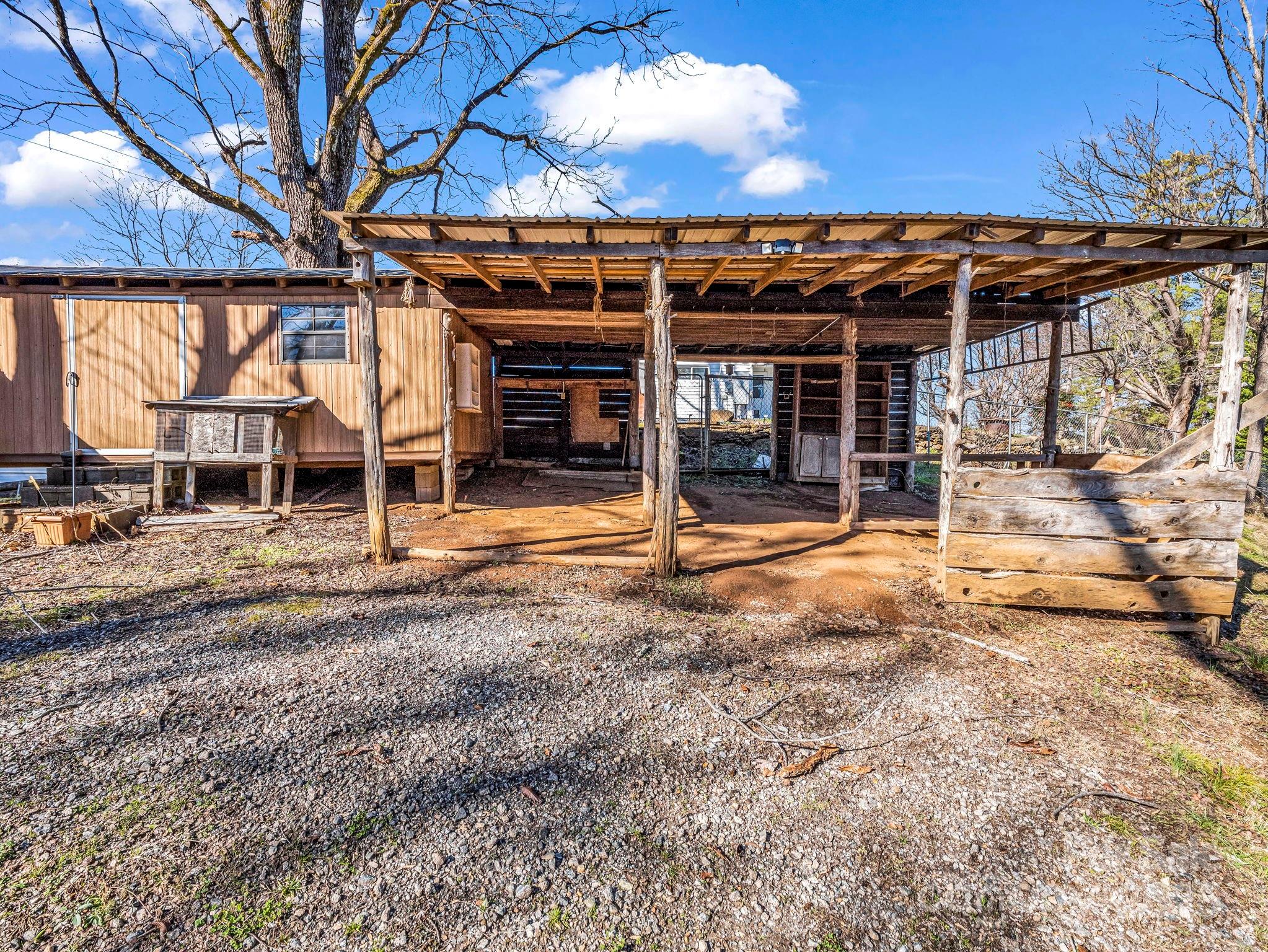 620 Smith Waldrop Road Columbus, NC 28722 - Photo 21 of 42 a backyard of a house with barbeque oven table and chairs