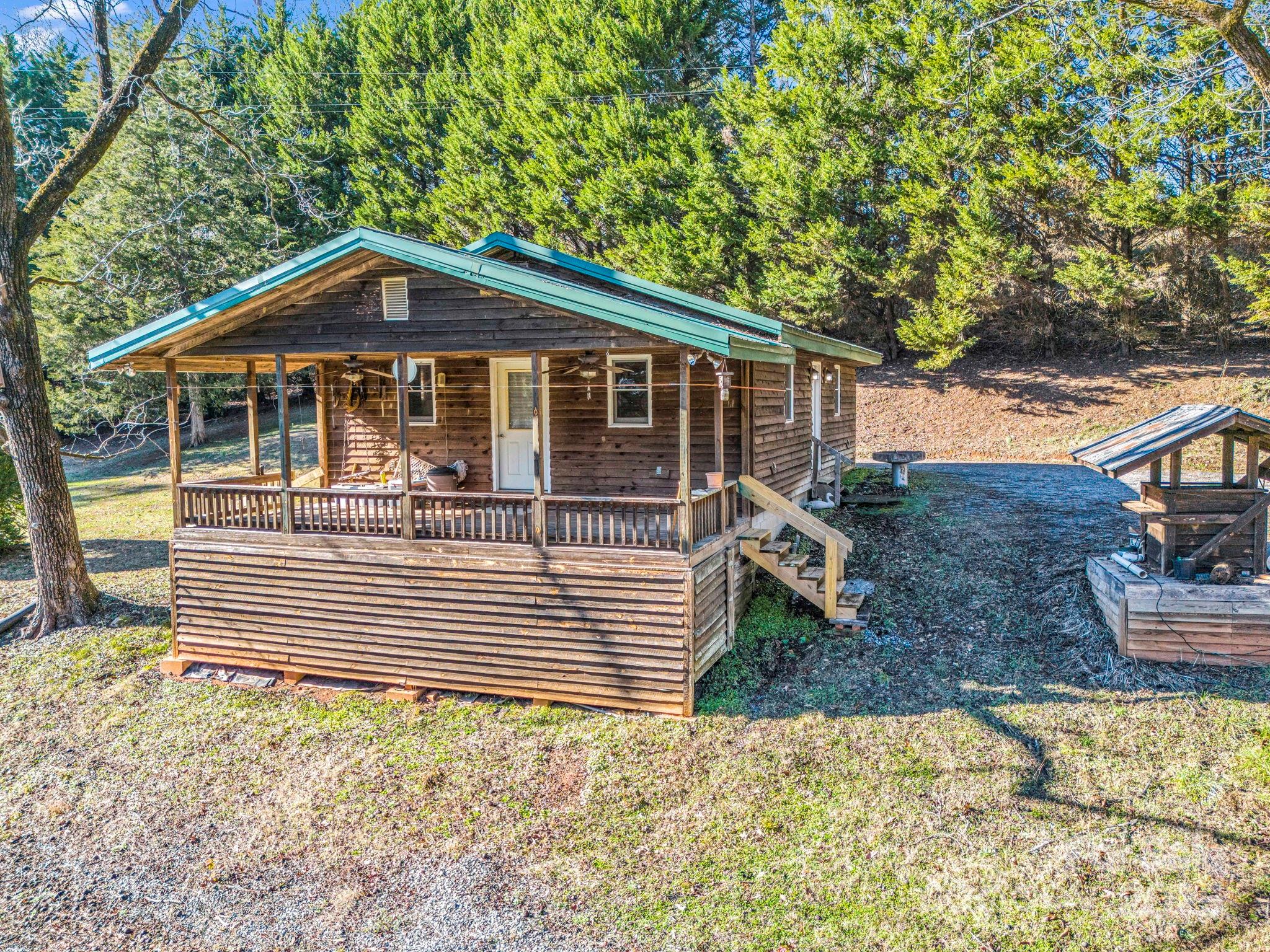 620 Smith Waldrop Road Columbus, NC 28722 - Photo 26 of 42 a front view of a house with a yard