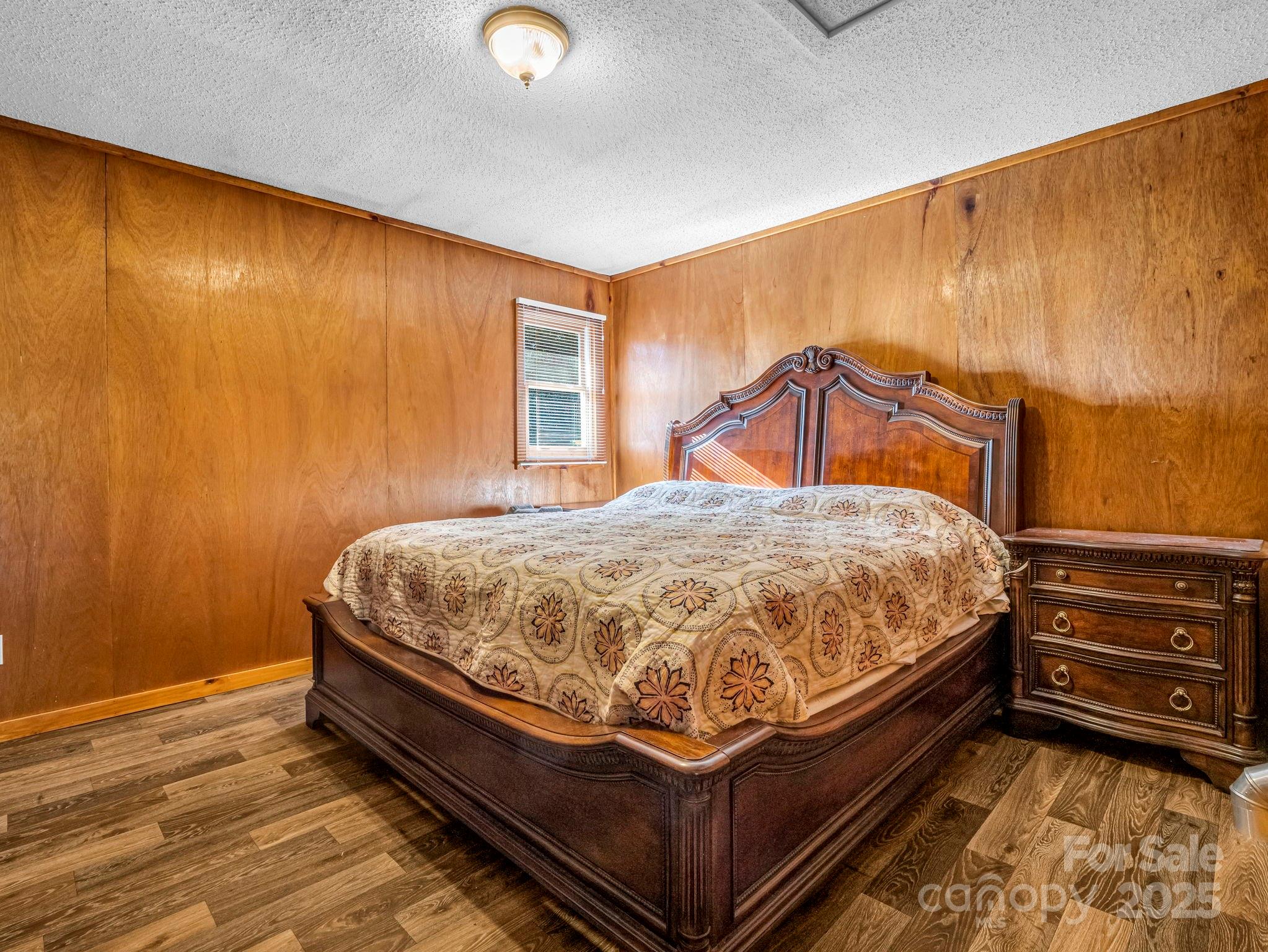 620 Smith Waldrop Road Columbus, NC 28722 - Photo 32 of 42 a bed sitting in a room next to a window