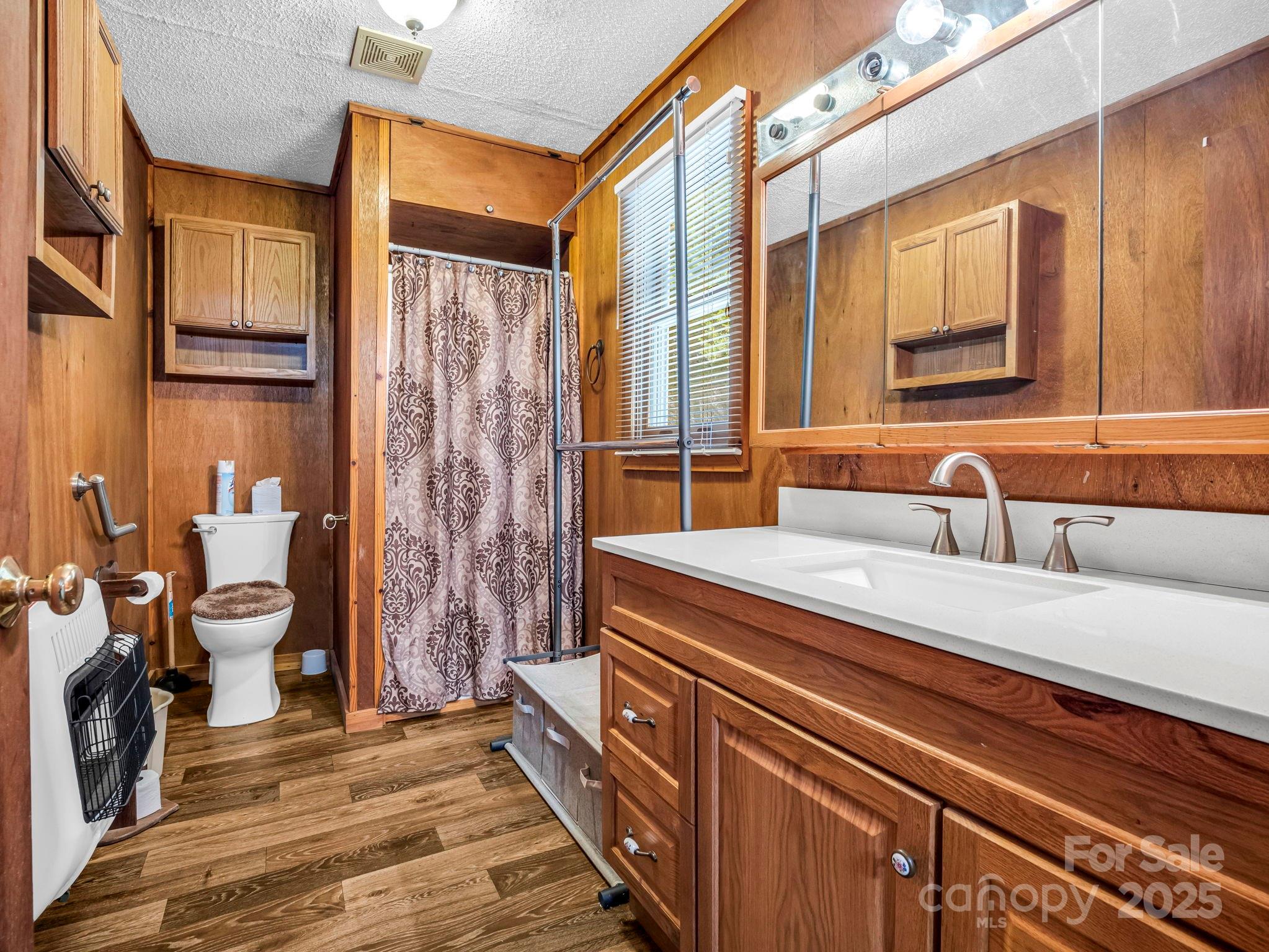 620 Smith Waldrop Road Columbus, NC 28722 - Photo 33 of 42 a bathroom with a sink and a mirror