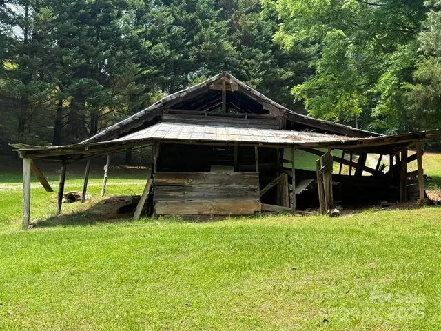 a view of a house with backyard and a slide